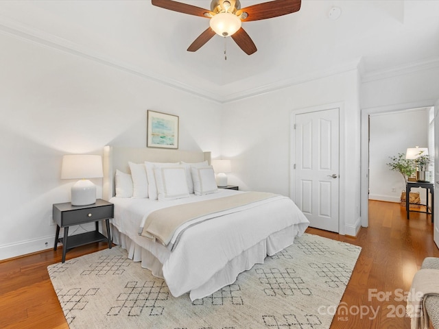 140 Villa Lake Dr, Fort Mill, SC 29708 - bedroom featuring ornamental molding, baseboards, wood finished floors, and ceiling fan