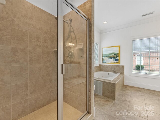 140 Villa Lake Dr, Fort Mill, SC 29708 - bathroom featuring ornamental molding, a stall shower, a jetted tub, and tile patterned floors