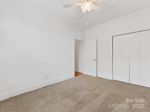 140 Villa Lake Dr, Fort Mill, SC 29708 - unfurnished bedroom with carpet flooring, ornamental molding, baseboards, a closet, and a ceiling fan