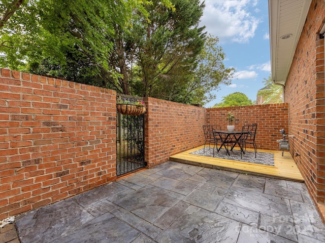140 Villa Lake Dr, Fort Mill, SC 29708 - view of patio / terrace with outdoor dining space and a gate