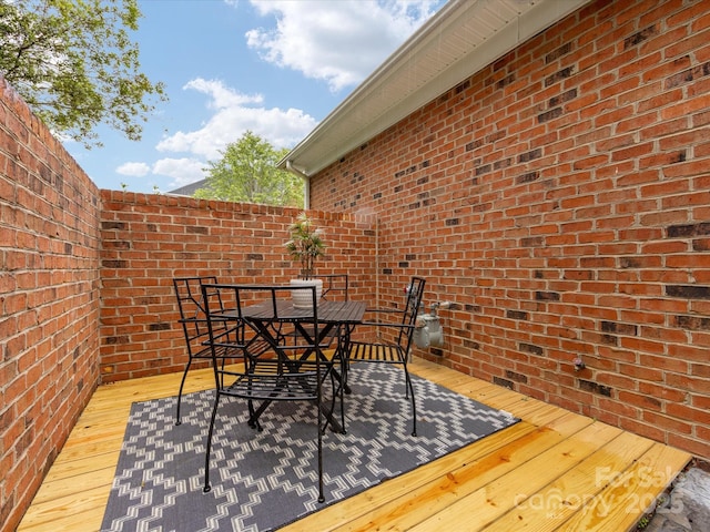 140 Villa Lake Dr, Fort Mill, SC 29708 - wooden terrace with outdoor dining area and fence