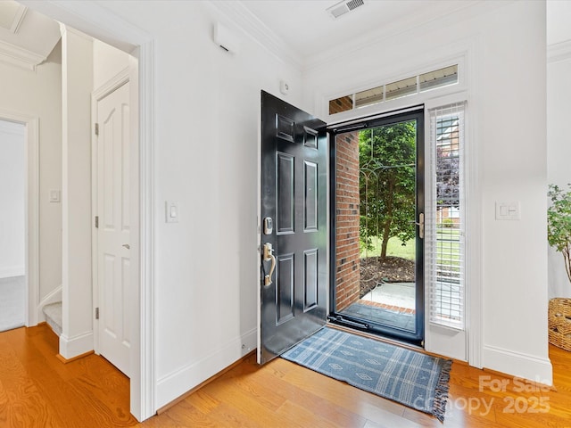 140 Villa Lake Dr, Fort Mill, SC 29708 - foyer with wood finished floors, crown molding, baseboards, and stairs