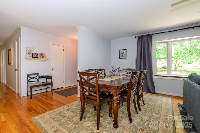 13030 Mayes Rd, Huntersville, NC 28078 - dining room with ornamental molding, baseboards, and light wood-type flooring