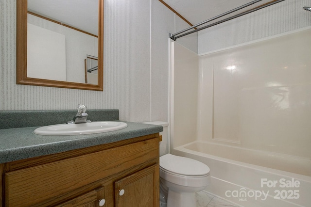 full bathroom featuring vanity, wallpapered walls, toilet, and tub / shower combination