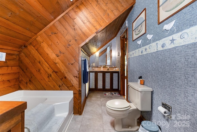full bathroom with wood ceiling, a bath, tile patterned floors, toilet, and lofted ceiling