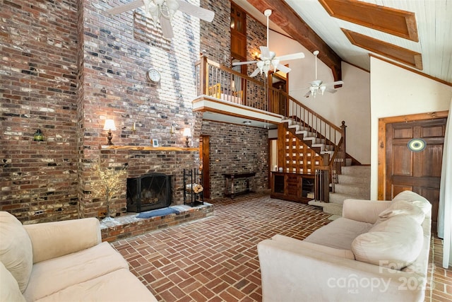 1160 Walton Pl, Salisbury, NC 28146 - living room featuring ceiling fan, brick flooring, stairway, high vaulted ceiling, and beam ceiling