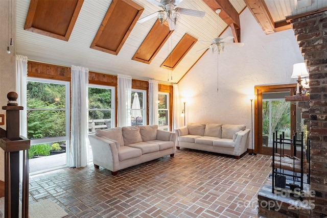 1160 Walton Pl, Salisbury, NC 28146 - living room with ceiling fan, a textured wall, healthy amount of natural light, brick floors, and a wooden ceiling with exposed beams