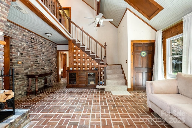 1160 Walton Pl, Salisbury, NC 28146 - living area featuring high vaulted ceiling, stairway, brick flooring, a ceiling fan, and wooden ceiling