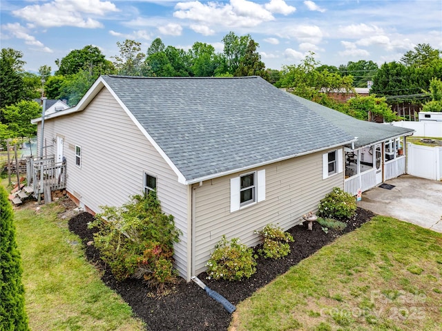 804 Rostan St SE, Valdese, NC 28690 - view of side of property with roof with shingles and view of wooded area
