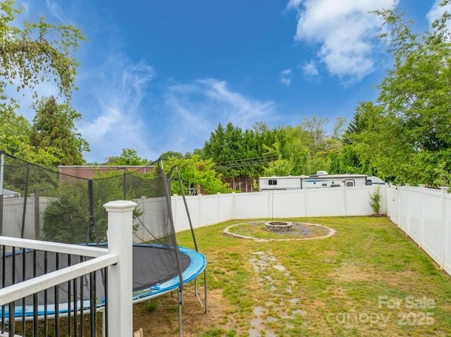 804 Rostan St SE, Valdese, NC 28690 - view of yard featuring a trampoline and an outdoor fire pit