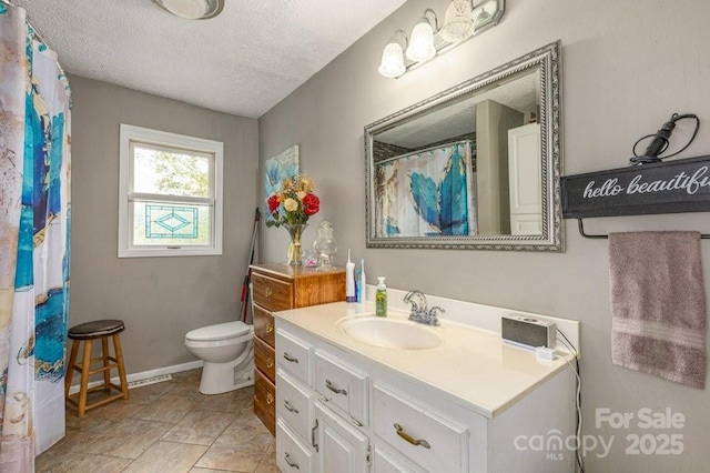 804 Rostan St SE, Valdese, NC 28690 - full bath with toilet, a textured ceiling, and vanity