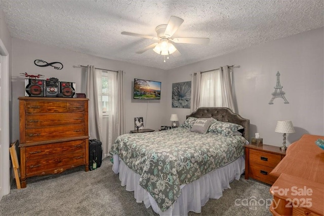 804 Rostan St SE, Valdese, NC 28690 - bedroom featuring light colored carpet, a textured ceiling, and a ceiling fan