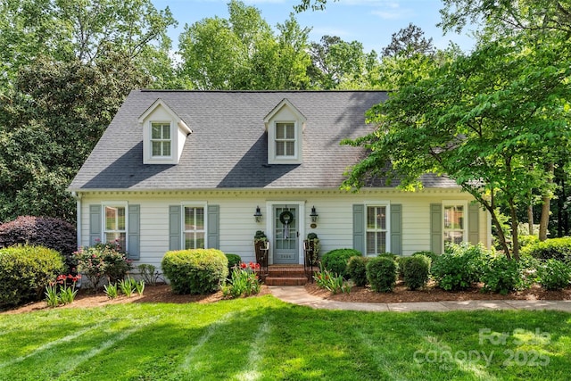 new england style home with a front yard