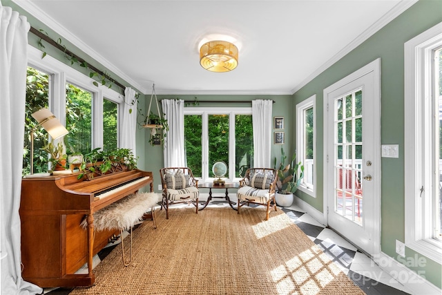 sunroom / solarium featuring french doors, ornamental molding, baseboards, and a wealth of natural light