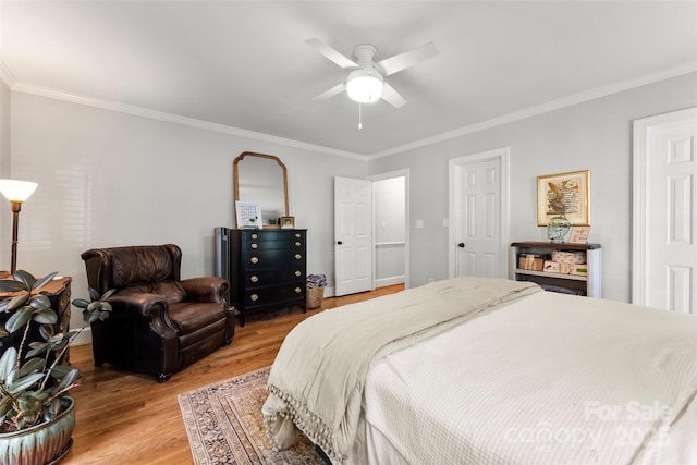 bedroom with ornamental molding, light wood finished floors, and ceiling fan