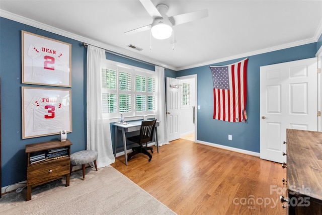 home office featuring crown molding, ceiling fan, visible vents, and wood finished floors