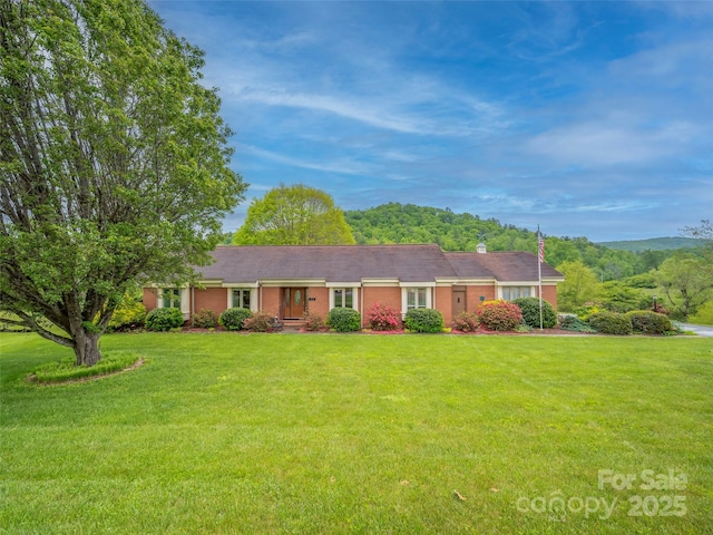 ranch-style home with a front yard