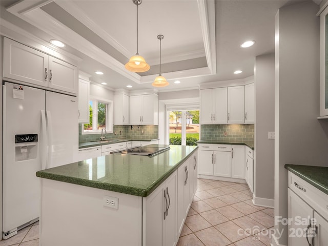 kitchen featuring white appliances, backsplash, a sink, plenty of natural light, and ornamental molding