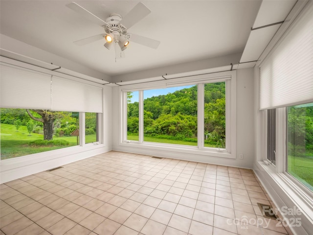 unfurnished sunroom featuring healthy amount of natural light