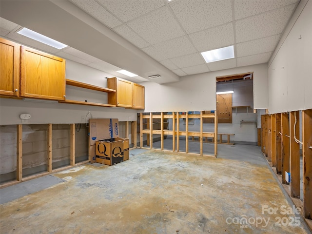 below grade area with a paneled ceiling