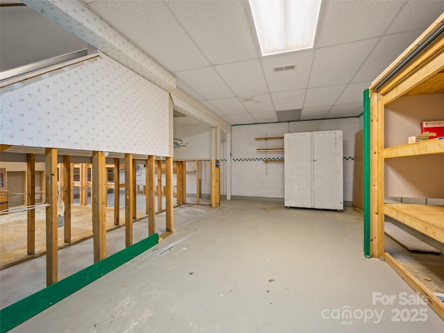 below grade area with a drop ceiling