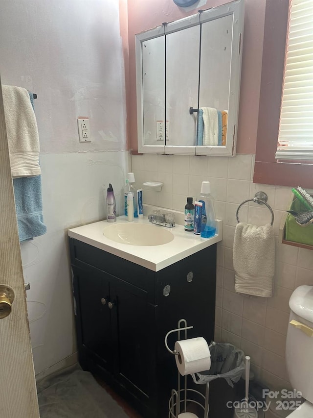 621 Benton St, Monroe, NC 28110 - half bath with vanity, toilet, and tile walls