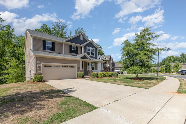 view of front of home featuring concrete driveway, an attached garage, a porch, and a front lawn