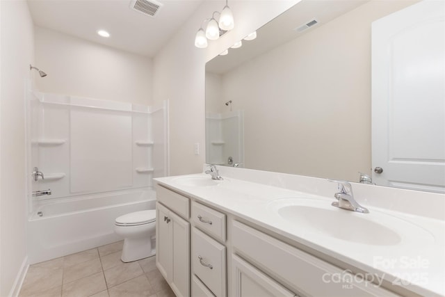 bathroom featuring tile patterned floors, toilet, shower / washtub combination, and double vanity