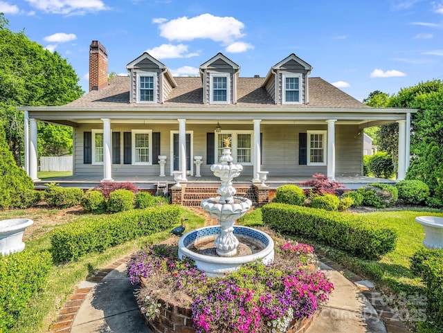 238 W Mountain St, Rutherfordton, NC 28139 - view of front of house featuring a porch, a chimney, and roof with shingles
