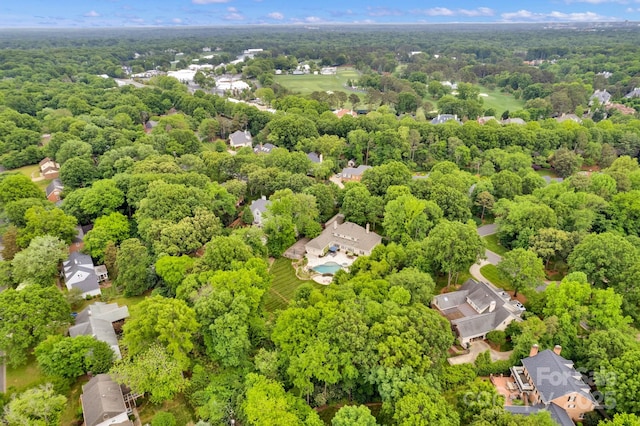 drone / aerial view featuring a view of trees