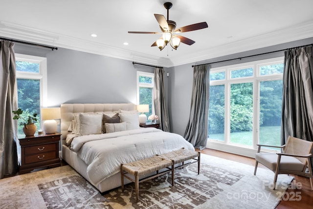 bedroom with recessed lighting, ceiling fan, ornamental molding, and light wood finished floors