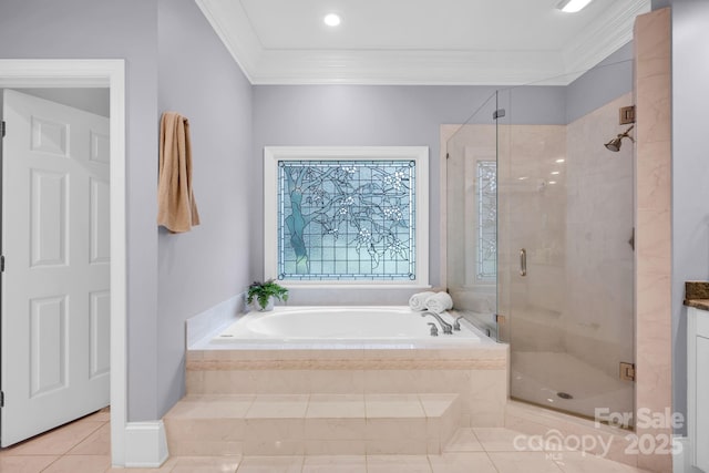 bathroom featuring tile patterned flooring, ornamental molding, a garden tub, and a stall shower