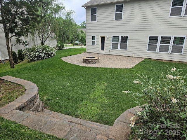 1071 Bassett Way, Fort Mill, SC 29707 - view of green lawn featuring an outdoor fire pit and a patio