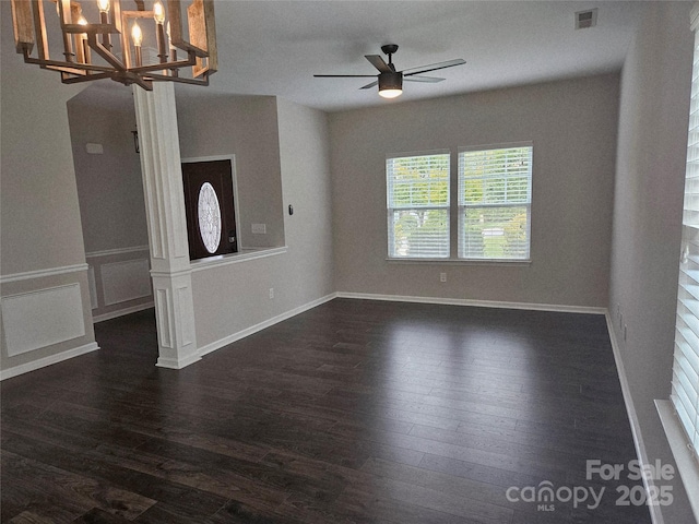 1071 Bassett Way, Fort Mill, SC 29707 - spare room with dark wood-style floors, a ceiling fan, a chandelier, and baseboards