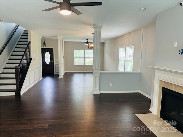 1071 Bassett Way, Fort Mill, SC 29707 - foyer featuring ornate columns, ceiling fan, wood finished floors, a fireplace, and stairway