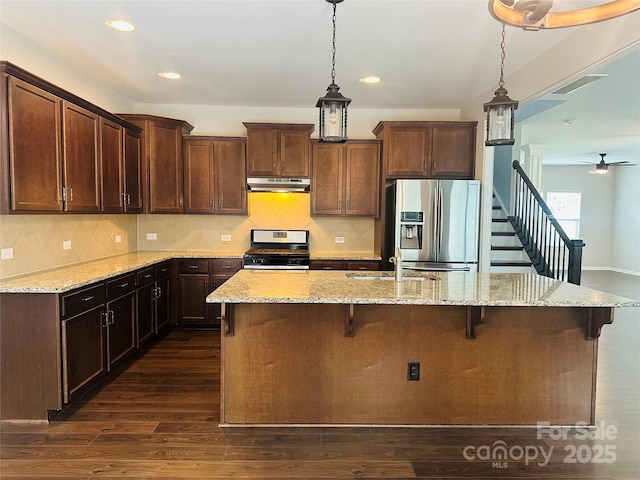 1071 Bassett Way, Fort Mill, SC 29707 - kitchen with stainless steel appliances, under cabinet range hood, a kitchen island with sink, pendant lighting, and recessed lighting