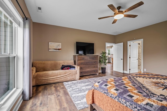 bedroom with a ceiling fan and wood finished floors