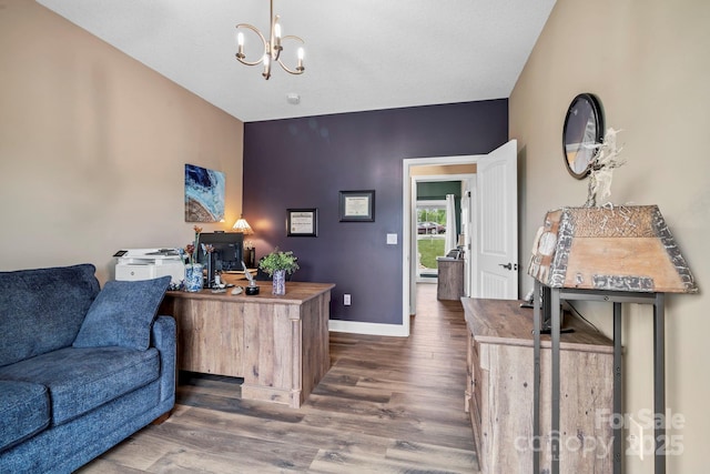 home office featuring an inviting chandelier, baseboards, and wood finished floors
