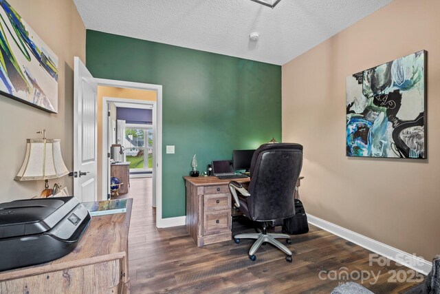 office space featuring baseboards, dark wood finished floors, and a textured ceiling
