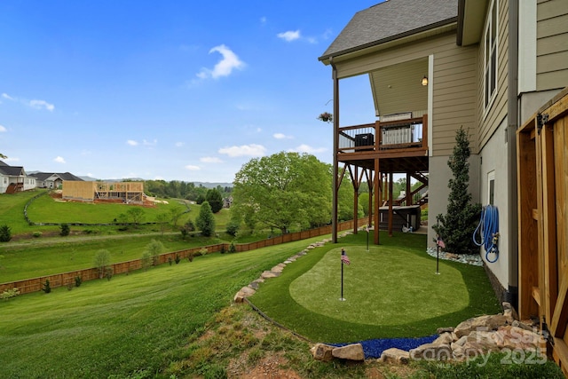 view of yard featuring stairway, fence, and a deck
