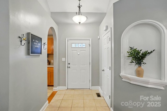 2745 Stockwood Dr, Gastonia, NC 28056 - entrance foyer featuring arched walkways, light tile patterned floors, and baseboards