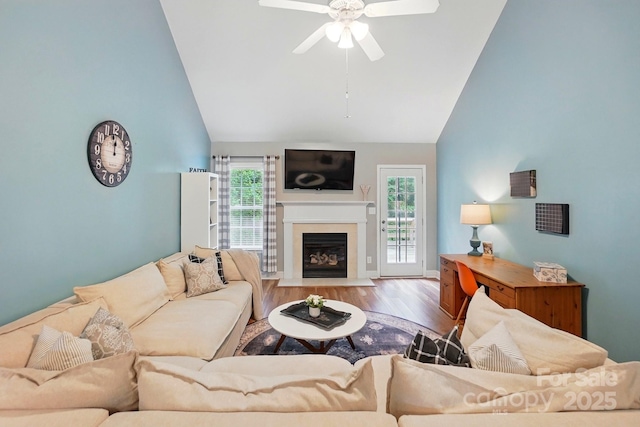 2745 Stockwood Dr, Gastonia, NC 28056 - living area with a ceiling fan, wood finished floors, a fireplace with flush hearth, healthy amount of natural light, and high vaulted ceiling