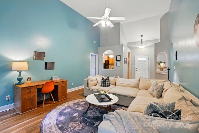 2745 Stockwood Dr, Gastonia, NC 28056 - living room featuring high vaulted ceiling, baseboards, light wood finished floors, a ceiling fan, and an office area
