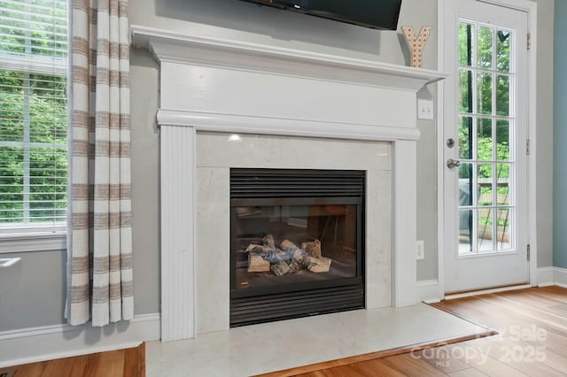 2745 Stockwood Dr, Gastonia, NC 28056 - detailed view of a premium fireplace, wood finished floors, and baseboards