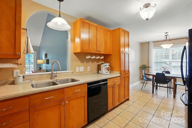 2745 Stockwood Dr, Gastonia, NC 28056 - kitchen with black appliances, a sink, light countertops, light tile patterned floors, and pendant lighting