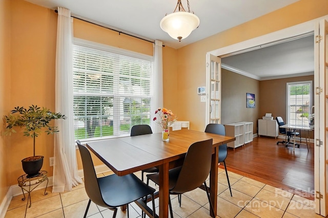 2745 Stockwood Dr, Gastonia, NC 28056 - dining area with crown molding, light tile patterned flooring, and baseboards