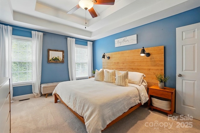 2745 Stockwood Dr, Gastonia, NC 28056 - carpeted bedroom with a tray ceiling, baseboards, and a ceiling fan
