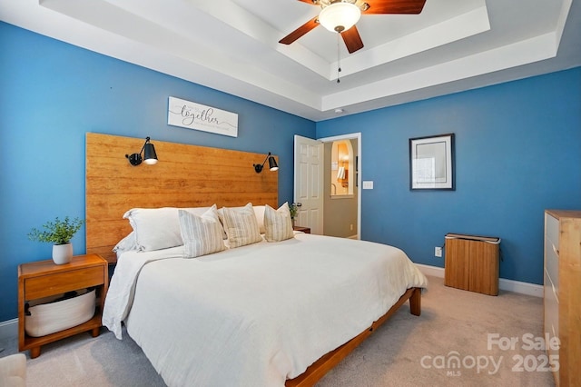 2745 Stockwood Dr, Gastonia, NC 28056 - bedroom featuring a tray ceiling, carpet flooring, baseboards, and ceiling fan
