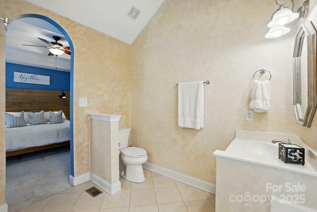 2745 Stockwood Dr, Gastonia, NC 28056 - bathroom featuring a ceiling fan, toilet, vanity, tile patterned floors, and baseboards