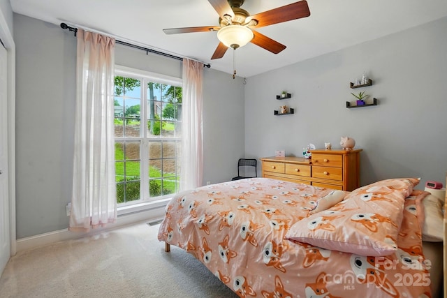 2745 Stockwood Dr, Gastonia, NC 28056 - carpeted bedroom with multiple windows, baseboards, and ceiling fan